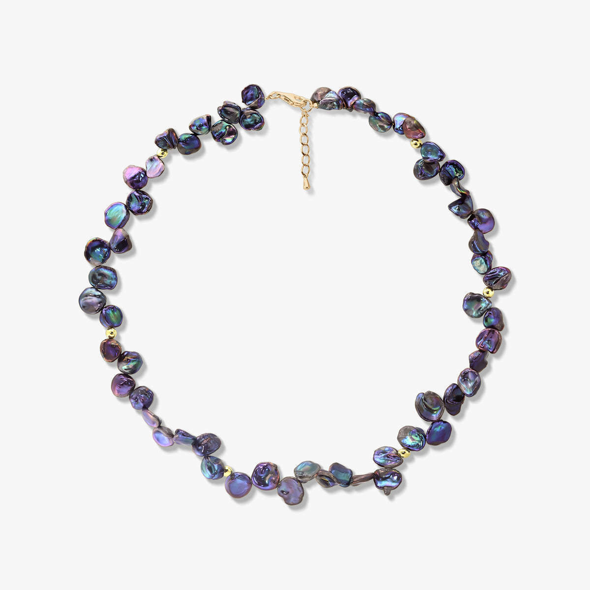 Iridescent black keshi pearl necklace with small gold accents and an adjustable extender chain, photographed on a white background.